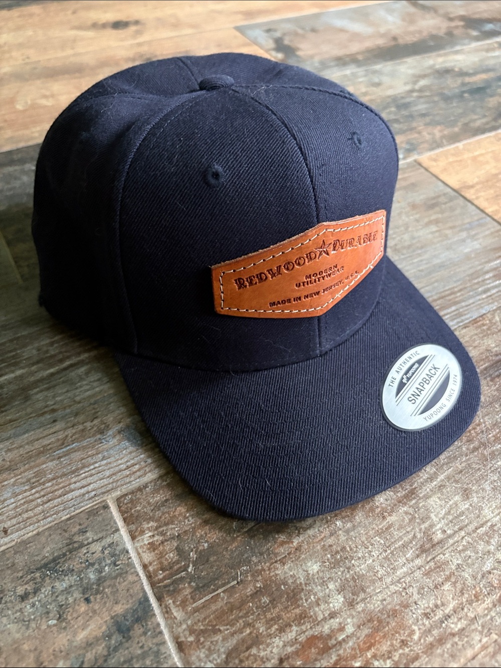 Redwood Durable Black Snapback Hat with custom Leather Patch